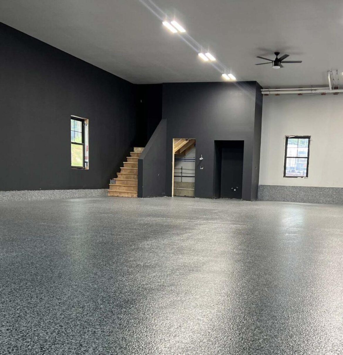 Grey flake epoxy floor in an open studio space