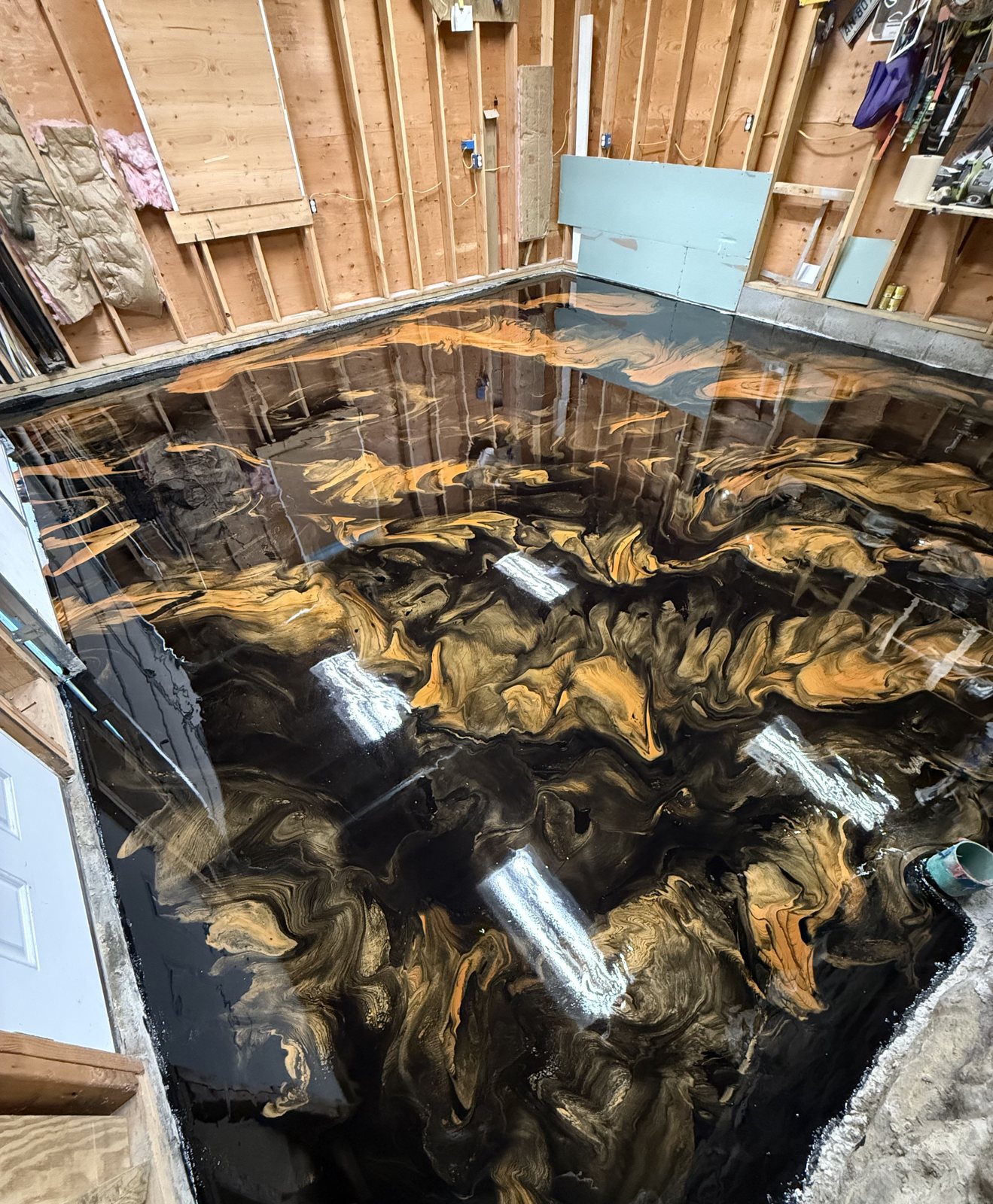 Gold metallic epoxy basement floor, wide view