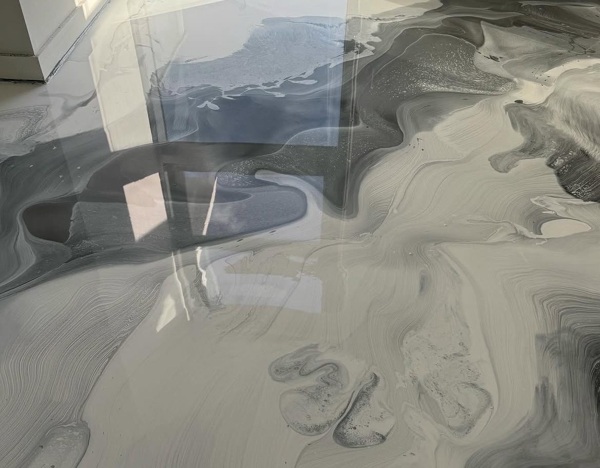 Close view of pearl and charcoal metallic marbling